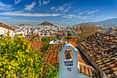 View of Athens and Likavitos Hill over the rooftops of the Plaka District, Athens, Greece, Europe