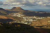View from the Mirador de Haria at the village of Haria and the Monte Corona, Lanzarote, Canary Islands, Islas Canarias, Spain, Europe
