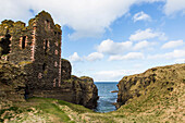 Clouds over Sinclairs Bay and stone ruins of Castle Sinclair Girnigoe, Scotland, UK