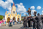 Participants of the Holy Saturday procession waiting in front of the San Felipe de Jesus Church near Antigua, Guatemala, Central America