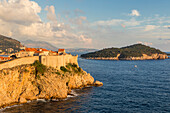 View to the city walls of Dubrovnik, UNESCO World Heritage Site, and Lokrum Island at sunset, Dubrovnik, Croatia, Europe
