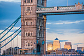 Tower bridge framing Canary Wharf at sunset, London, England, United Kingdom, Europe