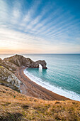 Durdle Door at sunrise, Lulworth Cove, Jurassic Coast, UNESCO World Heritage Site, Dorset, England, United Kingdom, Europe