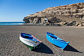 Small fishing boats on Playa Ajuy on the volcanic island of Fuerteventura, Canary Islands, Spain, Atlantic, Europe