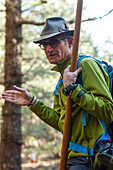 hiking guide with canarian crook, man, hiking tour along PR LP 14, hiking trail near Montana Quemada, volcanic crater, Llano del Jable, Parque Natural de Cumbre Vieja, UNESCO Biosphere Reserve, La Palma, Canary Islands, Spain, Europe