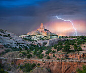 Lightning strikes near rock formation, Church Rock, Red Rock State Park, New Mexico