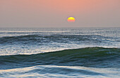 Sun setting over ocean, Cape Cross, Namibia