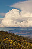Cumulonimbus cloud over mountains, Dempster Highway, Yukon, Canada