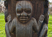 Wooden totem pole showing child, Kispiox, British Columbia, Canada