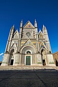 14th century Tuscan Gothic style facade of the Cathedral of Orvieto, designed by Maitani, Umbria, Italy.