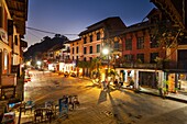 Shops, cafes, and traditional Newari architecture in Bandipur Bazaar, Nepal.