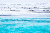 Winter Iclend landscape, with frozen hills and clear river.