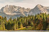 Lodge at Gerold Lake and Karwendel Alps in the background. Krün, Upper Bavaria, Bavaria, Germany.