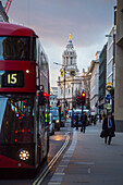 Detail of St Paul Cathedral wit red bus on the foreground. London, United Kingdom.