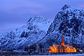 Illuminated church of Flakstad, Flakstad, Lofoten, Nordland, Norway