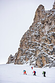 Several persons backcountry skiing ascending to Forcella Roa, Forcella Roa, Natural Park Puez-Geisler, UNESCO world heritage site Dolomites, Dolomites, South Tyrol, Italy