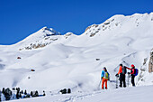 Three persons backcountry skiing ascending to Peitlerkofel, Peitlerkofel, Natural Park Puez-Geisler, UNESCO world heritage site Dolomites, Dolomites, South Tyrol, Italy