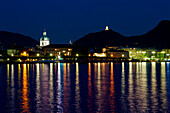 Como with evening lights from Como lake, Lombardy, Italy