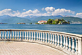 View of the Borromean Islands, Isola dei Pescatori and Isola Bella from a balcony on the lake front of Stresa in a spring day. Verbano Cusio Ossola, Lago Maggiore, Piedmont, Italy.