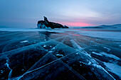 Ice cracks towards to an island Ogoy, lake Baikal, Irkutsk region, Siberia, Russia