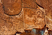 Petroglyph someone has attempted to remove with power tool, Grand Staircase-Escalante National Monument, Utah