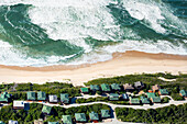 Waves breaking along developed coast, Mossel Bay, Western Cape, South Africa