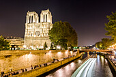 View of Notre-Dame Cathedral and Seine River at night, Paris, France