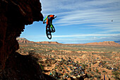 Rear view of person jumping over mountains during daytime, Utah, USA