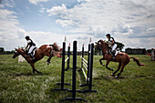 Photograph of equestrians on horses during show jumping competition, Purcellville, Virginia, USA