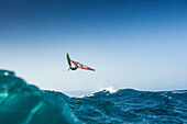 Professional windsurfer in mid-air, El Cabezo, Tenerife, Canary Islands, Spain