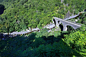 Europe, France, Auvergne stone bridge.