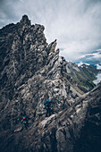 Two climbers on the ascent on a via ferrata, E5, Alpenüberquerung, 3rd stage, Seescharte,Inntal, Memminger Hütte to  Unterloch Alm, tyrol, austria, Alps