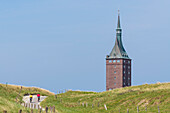 Cyclists in front of the Westturm, Wangerooge, East Frisia, Lower Saxony, Germany