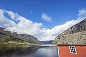 Red hut by the lake Granvinsvatnet, near Granvin, Hardanger, Hordaland, Fjord norway, Southern norway, Norway, Scandinavia, Northern Europe, Europe