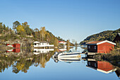 Boat and red huts in Laget, Aust-Agder, Sørlandet, Southern Norway, Norway, Scandinavia, Northern Europe, Europe