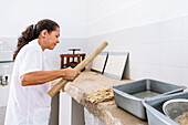 woman working at historical Paper Production at Fundación San Lorenzo, Barichara, Departmento Santander, Colombia, Southamerica