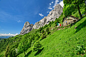 Hut rifugio Elisa standing beneath rock face, hut rifugio Elisa, Grigna, Bergamasque Alps, Lombardy, Italy