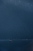 Stand-Up Paddlers riding at Eibsee below Zugspitze mountain, Grainau community, Garmisch-Partenkirchen, Bavaria, Alps, Germany