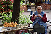 Unofficial street vendor within the Stary Kleparz market hall, Krakow, Malopolska Province (Lesser Poland), Poland, Central Europe.