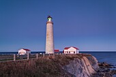 Canada, Quebec, Gaspe Peninsula, Cap-des-Rosiers, Cap-des-Rosiers Lighthouse, dusk.