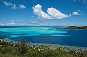 Hilltop view over pricey bungalows featuring fantastic views of the stunning bay, Bora Bora, Society Islands, French Polynesia, South Pacific