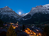 Grindelwald town with Eiger and Schreckhorn mountains in the blue hour, Bernese Oberland, Alps, Switzerland, Europe