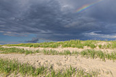 Rainbow over the dunes in St. Peter-Ording, peninsula Eiderstedt, North Frisia, Schleswig-Holstein, Northern Germany, Germany, Europe