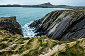 View along the coastline with rocky cliffs, Pembrokeshire National Park, Wales, UK.