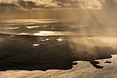 View over coast and sea in rain, Inverpolly Nature Reserve, Highlands, Scotland, UK