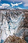 Mountaineer looks at the crevasses of the Glaciar Viedma, Cordon Mariano Moreno in the background, Los Glaciares National Park, Patagonia, Argentina