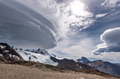 Climber at the Paso del Viento, cloud swirls, Los Glaciares National Park, Patagonia, Argentina