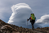 Climber at the Paso del Viento, cloudscape, Los Glaciares National Park, Patagonia, Argentina