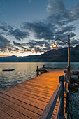 The jetty with lamp post at dusk. Glenorchy, Queenstown Lake district, Otago region, South Island, New Zealand.