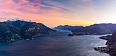 View of Bellagio and the two branches of Como Lake from Breglia during a winter sunset. Plesio, Como Lake, Lombardy, Italy.